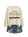 Close-up of ag teacher farm animal print on beige crewneck sweatshirt and denim shorts - S / Sand Sweatshirt (Black Text Pattern)