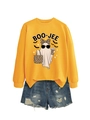 Detail of Boo-Jee ghost print on yellow sweatshirt paired with ripped denim shorts - Yellow