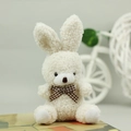Close-up of white plush bunny with checkered bow tie showing soft teddy velvet texture - Beige / 10cm