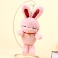 Cute pink plush rabbit keychain featuring sparkling sequin ears and a small gold bell - Pink