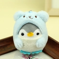 Plush penguin keychain wearing a light blue bear hood on a wooden display stand - Around 9cm / Blue