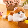 Cute realistic orange and white plush cat doll in lying position with blue eyes - Length 20cm / Amber White