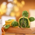 Close-up of green plush turtle keychains showing soft texture and metal hooks - Key Ring Style / Green/Yellow
