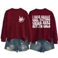 Detail of burgundy crewneck sweatshirt with white skeleton hand and slogan printing - S / Tops / Wine Red (White Print)