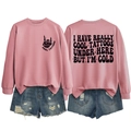 Pink oversized sweatshirt showing front and back print details with denim shorts - S / Tops / Rose Gold (Black Print)