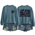 Flat lay of blue-grey sweatshirt with skull hand print and distressed denim shorts - S / Tops / Blue (Black Print)