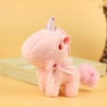 Pink plush unicorn keychain with purple glitter horn and soft silk ribbon bow accessory - Pink / Approx. 12cm