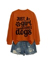 Flat lay of an orange crewneck sweatshirt with 'JUST A girl WHO LOVES dogs' graphic text - Burnt Orange (Black Font)