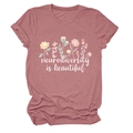 Detail of pink cotton T-shirt with flower print and Neurodiversity is beautiful text - S / Tops / Rose Gold (White Text)