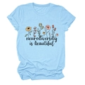 Close-up of floral print and neurodiversity is beautiful text on sky blue cotton tee - S / Tops / Light Blue (Black Text)