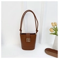Detail of a brown leather bucket bag with a golden geometric buckle and knotted strap - Brown