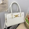 Elegant white leather crossbody bag with chic golden heart clasp and slim shoulder strap - White