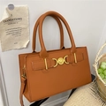 Caramel brown leather crossbody handbag with golden heart buckle and top handles - Brown
