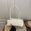 Minimalist white baguette underarm bag with bow drawstring and fashion text detail - White
