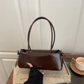 Dark brown glossy leather baguette bag with bow detail and twin shoulder straps - Brown