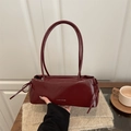 Elegant wine red shoulder bag with bow detail and glossy finish for daily commute - Red
