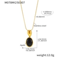 Macro detail of oval black agate pendant on 100cm stainless steel golden snake chain - Gold/Black Agate