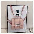 Mini mochila rosa de cuero sintético con lazo metálico plateado y correas ajustables - Rosa