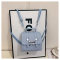 Mini mochila azul claro de cuero con elegante lazo plateado y correas ajustables - Azul