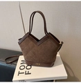 Detail of dark brown suede basket bag featuring quilted stitching and golden JBH logo - Coffee without Pendant