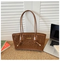 Detalle de bolso tote con estampado de leopardo, letras doradas y asas con nudos decorativos - Marrón Amarillento