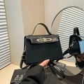 Classic black leather Kelly style handbag with gold twist-lock and top handle - Black