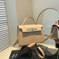 Elegant khaki trapezoid handbag with gold metal clasp and adjustable strap for women - Khaki
