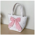 Detail view of large white canvas tote bag with pink bow and silver star patterns - White with Pendant