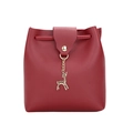 Red mini crossbody bucket bag in pebble leather with a gold deer charm decoration - Red