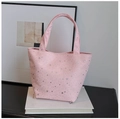 Detail shot of a pink canvas tote bag with sparkling silver star sequins on white books - Pink Without Pendant
