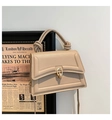 Elegant beige structured crossbody bag with geometric texture and knot handle detail - Khaki