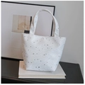 Detailed close-up of white canvas tote bag featuring metallic silver star prints - White Without Pendant
