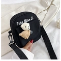 Detail of a black canvas crossbody bag featuring 3D plush bears and Tide Mian Zi embroidery - Pendant Badge Plush Toy Black