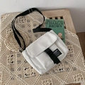 Minimalist white canvas messenger bag with black adjustable strap and buckle closure - White (Without Charm)