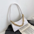 White faux leather crescent bag with crocodile pattern and decorative gold chain strap - White
