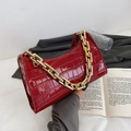 Deep red crocodile embossed baguette bag with a chunky gold chain handle and shiny PU finish - Red