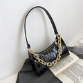 Black crocodile embossed hobo bag with a thick gold chain and slim shoulder strap - Black