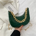 Dark green faux crocodile crescent bag with bold gold chains on white background - Green