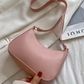 Pink lychee grain leather hobo bag with gold hardware ring and curved crescent shape - Pink