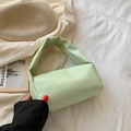 Borsa a mano cilindrica verde menta in morbida pelle con un manico imbottito elegante - Verde