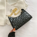 Chic black quilted baguette bag with decorative chunky gold chain strap and moon shape - Black