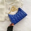 Quilted crossbody bag in vibrant Klein Blue featuring a chunky gold chain strap - Blue