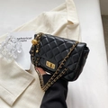 Classic black quilted shoulder bag with gold chain strap and metallic ball charm - Black