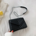 Minimalist black quilted crossbody bag with silver chain strap and V-shaped stitching - Black