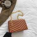 Brown quilted crossbody bag with V-shaped stitching and golden chain strap detail - Brown