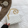 Elegant white quilted crossbody bag with gold chain strap on soft fabric background - White