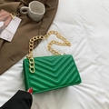 Chic emerald green quilted crossbody bag with V-shaped stitching and gold chain strap - Green