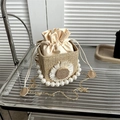 Straw square crossbody bag with white daisy flower, pearl handle, and gold chain strap - Khaki