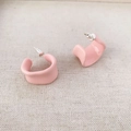 Pink irregular C-shaped enamel earrings with 925 silver needle on beige fabric background - Pink