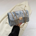 Light blue ruched oxford chain shoulder bag with a gold metal clasp and textured surface - Blue